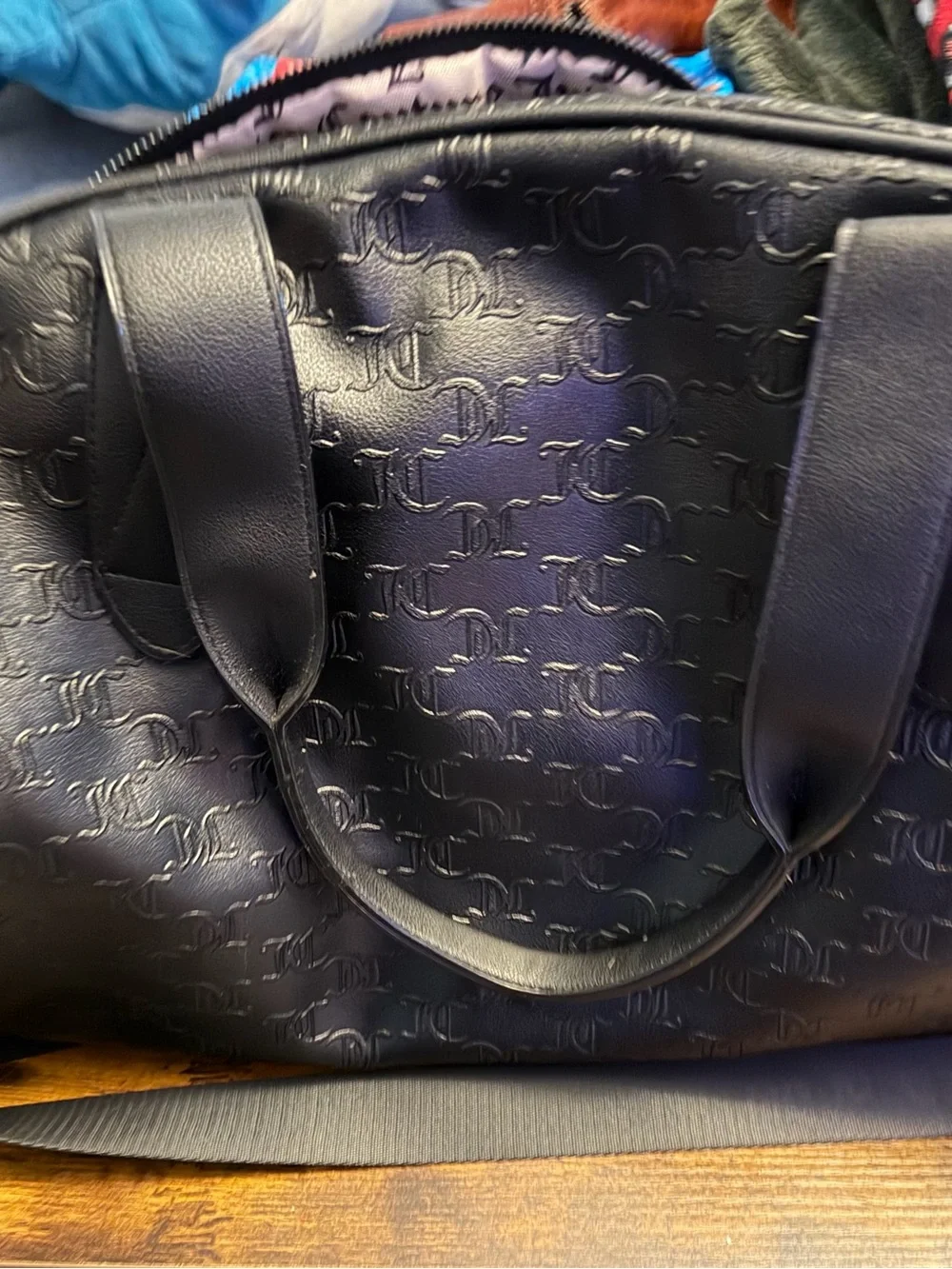 Juicy Couture Black Embossed Leather Travel Duffel